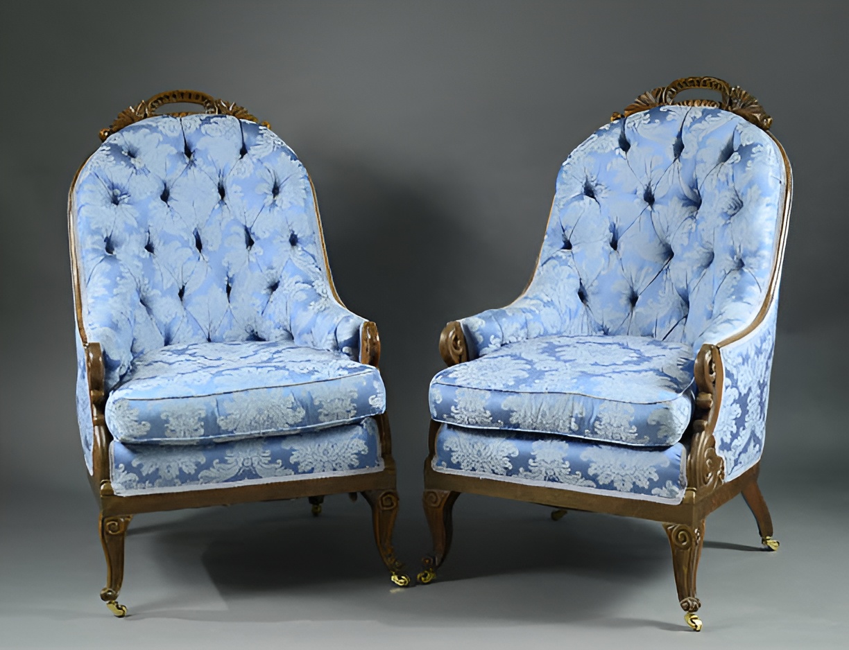 two victorian-style armchairs with blue brocade upholstery